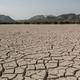 Dried cracked mud is seen at the Valdeinfierno Reservoir in Zarcilla de Ramos, Spain.